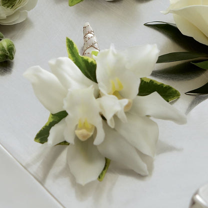 White Mini Cymbidium Boutonniere –  Diana Flowers, Passaic NJ